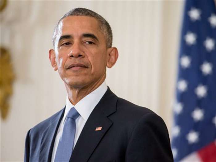 President Barack Obama accompanied by President Francois Hollande of France pauses while speaking during a joint press conference in the East Room at the White House in Washington Tuesday Nov. 24 2015. Hollande's visit to Washington is part of