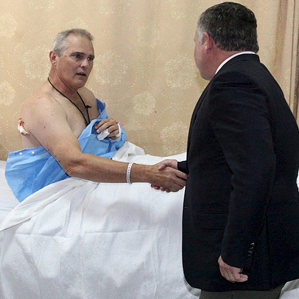 Jordans King Abdullah visits a man in hospital