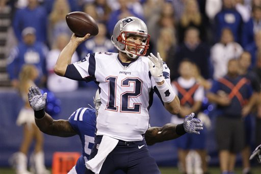 New England Patriots quarterback Tom Brady throws against the Indianapolis Colts in the first half of an NFL football game in Indianapolis. The Associated Press will announce its 2015 NFL award winners the