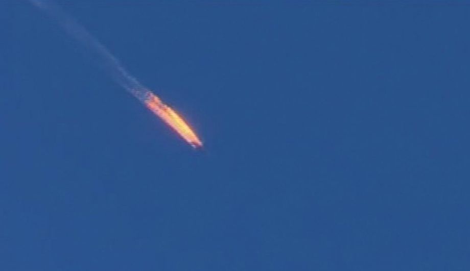 This video frame grab shows a Russian warplane on fire before crashing on a hill as seen from Hatay province Turkey. The downing of the plane by Turkish jets increased tensions in the region and sent oil prices up slightly