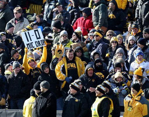 Iowa fans cheer during the first half of an NCAA college football game against Purdue Saturday Nov. 21 2015 in Iowa City Iowa. Iowa won the game 40-20 to improve to 11-0 on the season