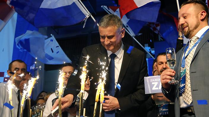 Opposition's leader Tomislav Karamarko of the Croatian Democratic Union celebrates the party's victory in downtown Zagreb