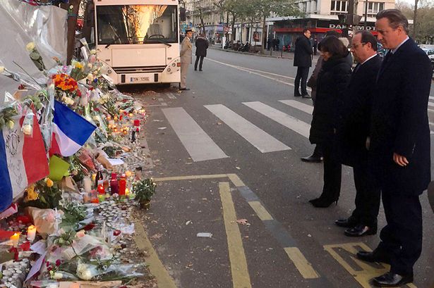 David Cameron of the Prime Minister with French President Francois Hollande outside the Bataclan Cafe in Paris