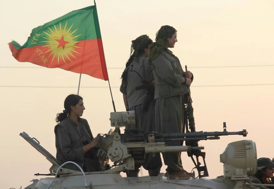 PKK fighters driving a tank into Shingal