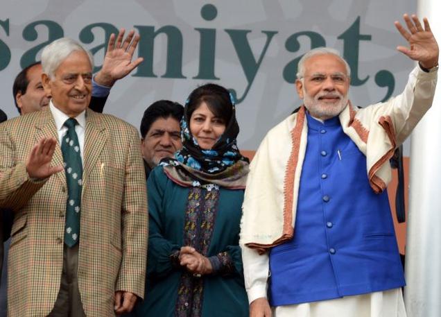 Prime Minister Narendra Modi with Jammu and Kashmir Chief Minister Mufti Mohammad Sayeed and Peoples Democratic Party leader Mehbooba Mufti at a rally in Srinagar on Saturday