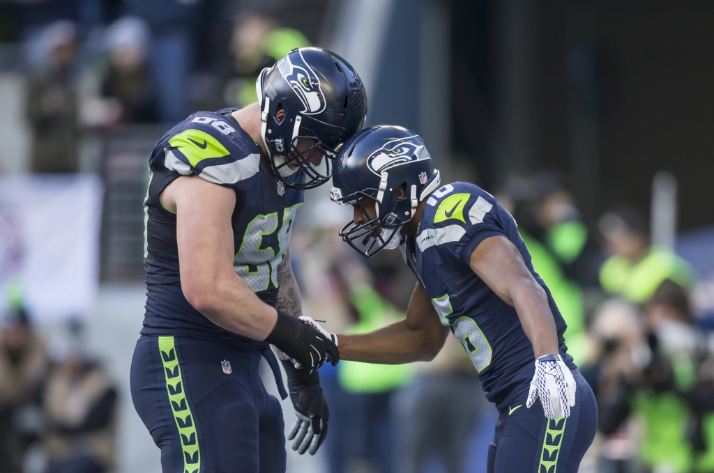 SEATTLE WA- November 20 Wide receiver Tyler Lockett #16 of the Seattle Seahawks celebrates scoring a touchdown with Justin Britt #68 of the Seattle Seahawks during the first half of a football game against the San Francisco 49ers at Century Link Field