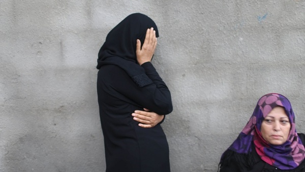 A relative mourns the death of Palestinian Khalil Obeid 25 who died from a wound he sustained during clashes with the Israeli troops Oct. 25 2015