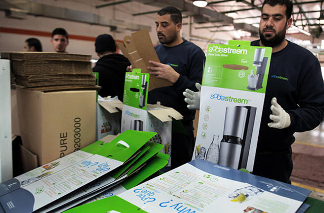 Palestinian workers at the Soda Stream factory in the West Bank settlement of Maale Adumim