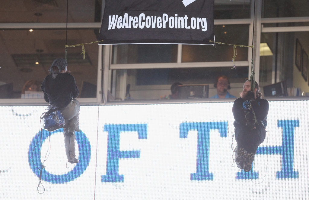 Protesters hang from the railings during the Carolina Panthers versus Indianapolis Colts Monday Night Football game at Bank of America Stadium