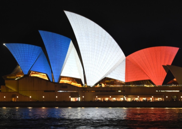 The iconic sails of the Sydney Opera House are lit in red white and blue