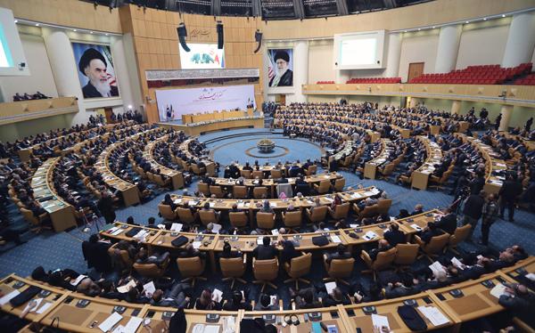 Participants listen to Iranian Oil Minister Bijan Namdar Zanganeh speech during the ‘Tehran Summit’ in the Iranian capital on Saturday