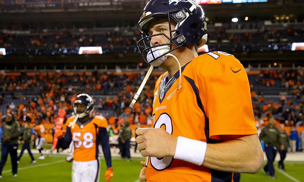 DENVER CO- NOVEMBER 15 Quarterback Peyton Manning #18 of the Denver Broncos walks on the field following the Broncos loss to the Kansas City Chiefs as Von Miller #58 follows at Sports Authority Field Field at Mile High