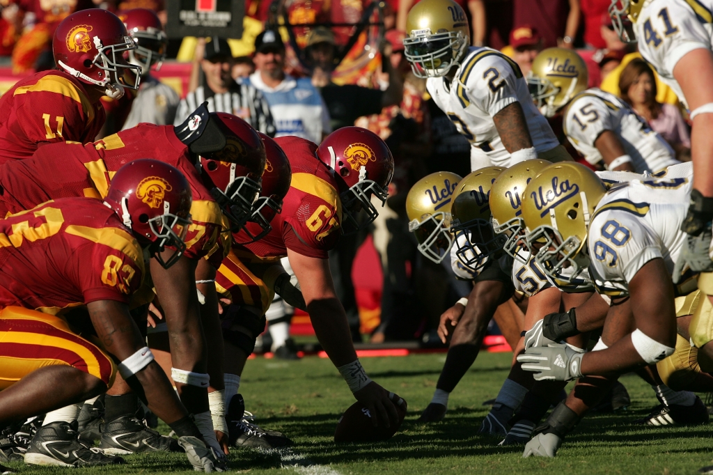 LOS ANGELES CA- DECEMBER 03 Matt Leinart #11 of the USC Trojans stands under center Ryan Kalil #67 at the line of scrimmage against the UCLA Bruins defense