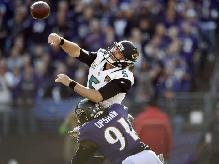 Jaguars quarterback Blake Bortles is hit by Ravens linebacker Courtney Upshaw causing an incomplete pass. AP