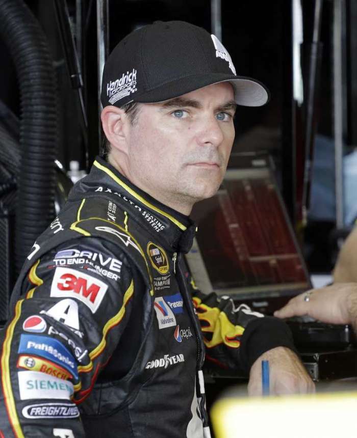 Jeff Gordon looks on in the garage area before practice for Sunday's race at Homestead Miami Speedway.  AP