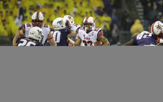 Devontae Booker runs toward Washington defensive back Sidney Jones during the first half of an NCAA college football game Saturday Nov. 7 2015 in Seattle