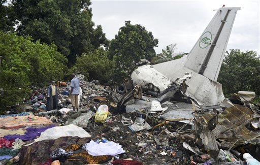 Responders pick through the wreckage of a cargo plane which crashed in the capital Juba South Sudan Wednesday Nov. 4 2015. The cargo plane was taking off from the South Sudanese capital of Juba when it crashed along the banks of the Nile River killing