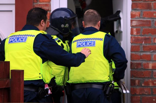 Police raiding a property