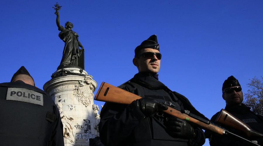 Police stand guard in Place de la Republique following the series of deadly attacks in Paris