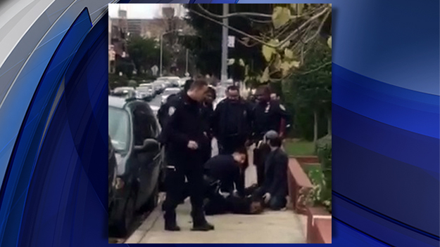 Police surround a man after a shooting in Crown Heights on Nov. 18 2015