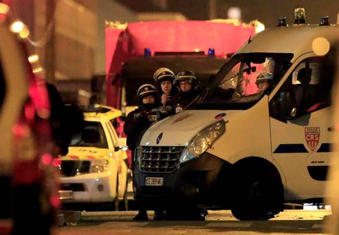 Police take up position near the scene of a shootout in Roubaix northern France REUTERS  Pascal Rossignol