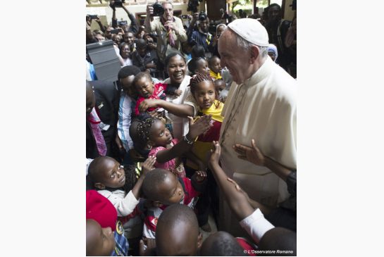 Pope Francis is cheered by children during his Friday visit to Kangemi one of the 11 slums dotting Nairobi Kenya He denounced the conditions slum-dwellers are forced to live