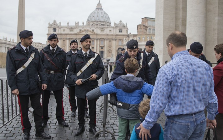 People were searched at a security checkpoint as they arrived to attend Pope's weekly general audience in St. Peter's Square at the Vatican Wednesday Nov. 18 2015