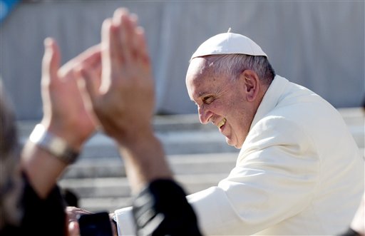 Pope Francis blesses the faithful at the end of the weekly general audience he held in St. Peter's Square at the Vatican Wednesday Nov. 11 2015