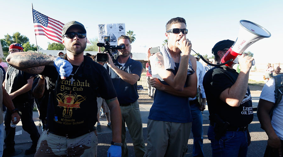 Protesters rally outside the Islamic Community Center in Phoenix Arizona