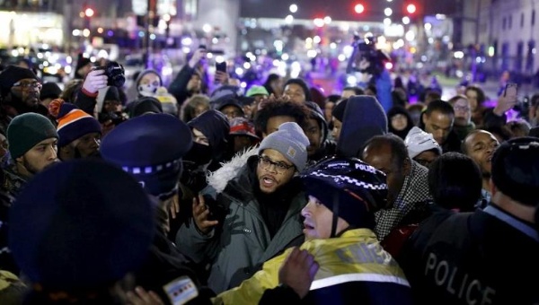 Protesters confront police officers during a demonstration after the release of a video showing the shooting of Laquan McDonald in Chicago Illinois Nov 24 2015