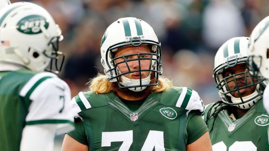 EAST RUTHERFORD NJ- DECEMBER 01 Nick Mangold #74 of the New York Jets looks on against the Miami Dolphins