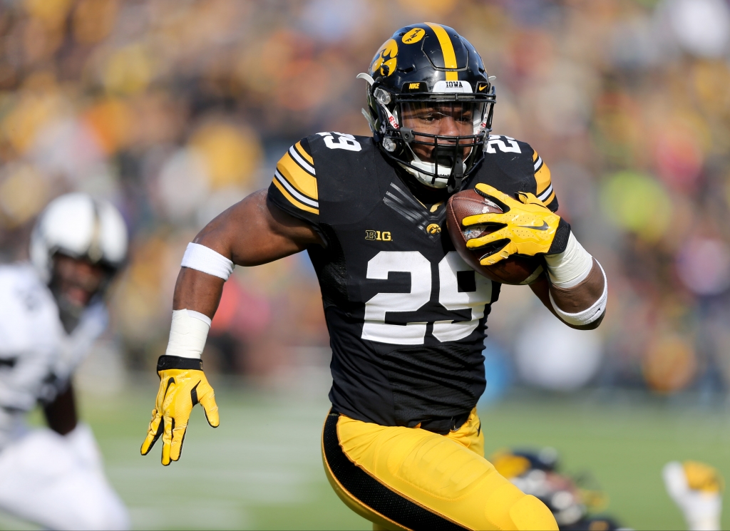 Iowa running back Le Shun Daniels Jr. runs for a touchdown during the first half of an NCAA college football game against Purdue Saturday Nov. 21 2015 in Iowa City Iowa