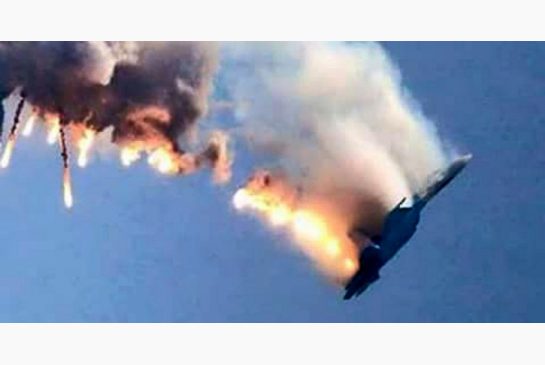 A Russian fighter jet coming down after being shot down by Turkey near the Syrian border on Tuesday. One Russian pilot was allegedly killed on the ground and a second was rescued