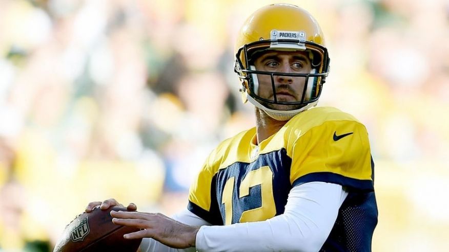 GREEN BAY WI- OCTOBER 18 Aaron Rodgers #12 of the Green Bay Packers drops back to pass during a game against the San Diego Chargers at Lambeau Field