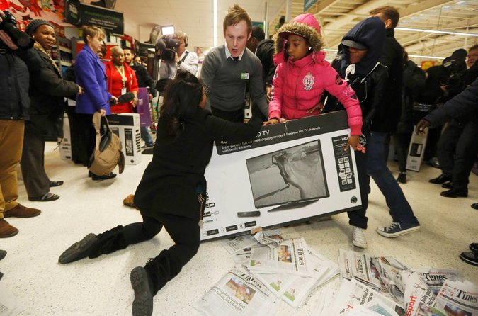 Wrestling over a television on Black Friday at an Asda superstore last year. The company said it would not participate in Black Friday this year. Credit Luke Macgregor  Reuters