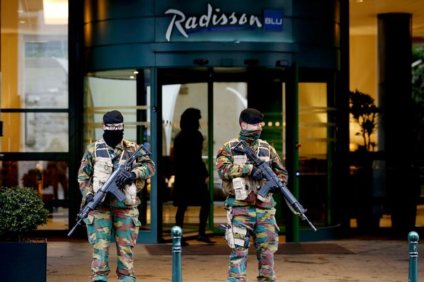 Belgian soldiers stand guard