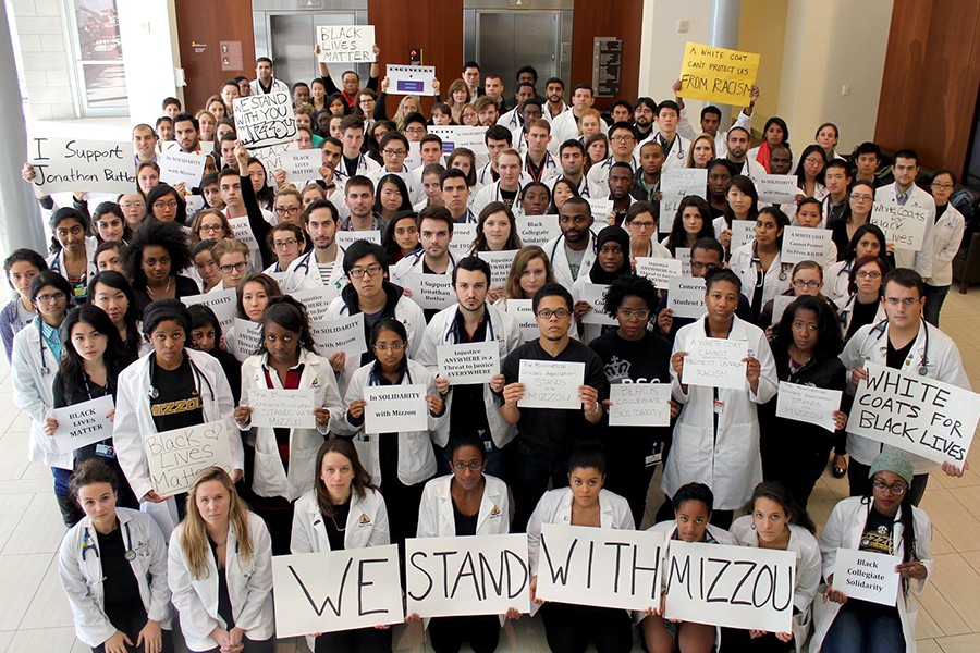 Students who took part in demonstration pose for