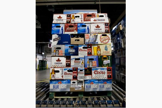 A pallet of empty bottles begins the refilling process on a conveyer at Molson Breweries in Toronto