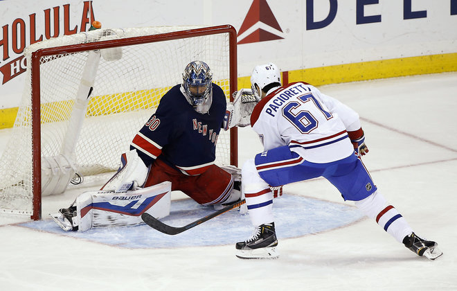 Montreal Canadiens left wing Max Pacioretty scores against New York Rangers goalie Henrik Lundqvist during the third period of an NHL hockey game Wednesday Nov. 25 2015 in New York. The Canadiens won 5-1