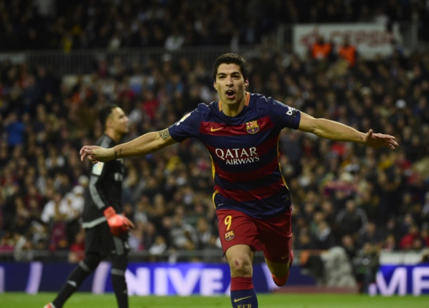 Luis Suarez celebrates after scoring