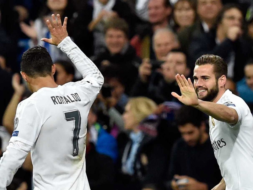 Real Madrid celebrate after scoring vs PSG in the Champions League