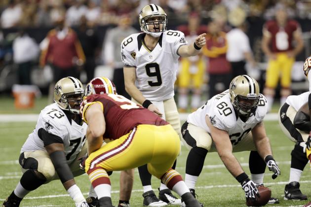 New Orleans LA USA New Orleans Saints quarterback Drew Brees under center Brian De La Puente during the second half of a game against the Washington Redskins at the Mercedes Benz Superdome. The Redskins defeated the Saints 4