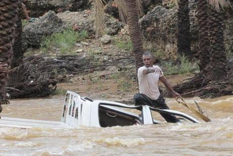 Flood waters trapped a man atop a vehicle on Yemen’s island of Socotra in the Indian Ocean Monday