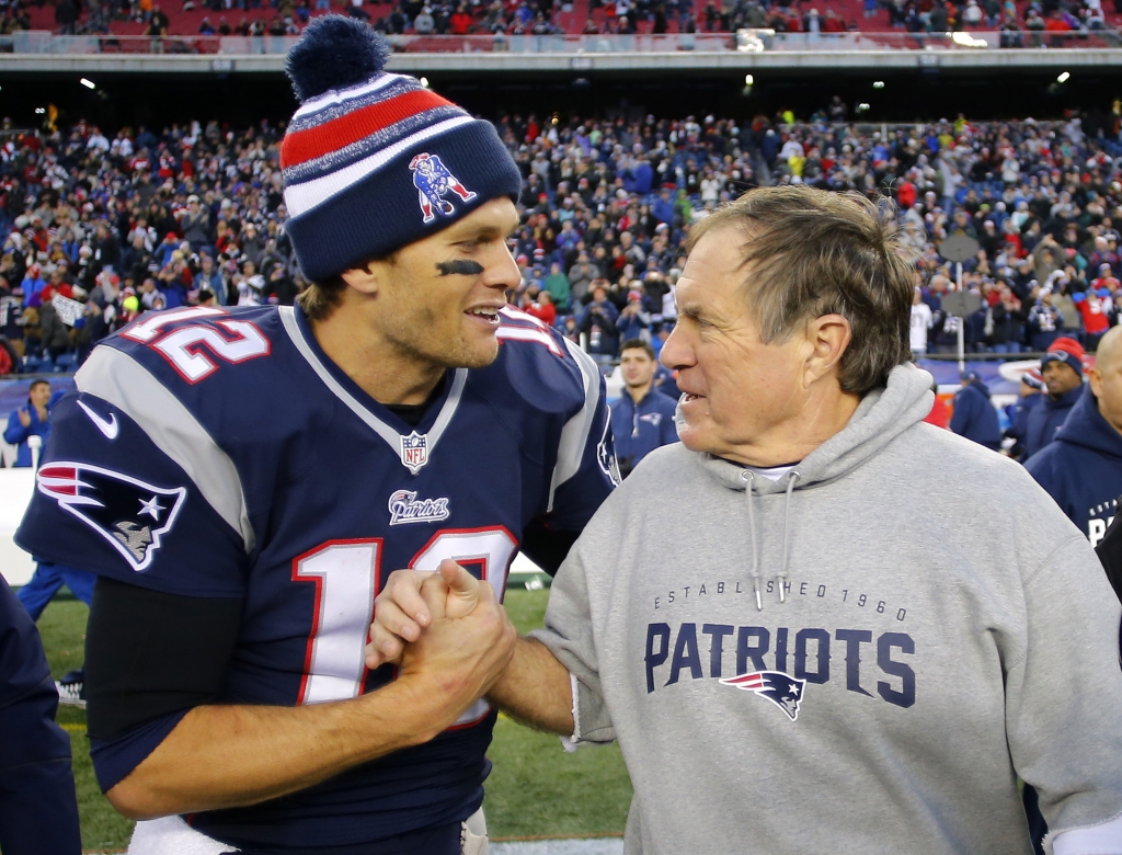 Dec 14 2014 Foxborough MA USA New England Patriots quarterback Tom Brady celebrates with head coach Bill Belichick after clinching the AFC East title with a 41-13 win over the Miami Dolphins at Gillette Stadium. Mandatory Credit Winslow Tow