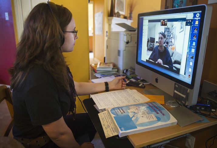 Ricardo B. Brazziell Sydney Clark a high school senior works on her Russian language with her tutor Julia Dene during a Skype class at her home