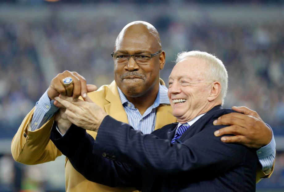 Hall of Famer Charles Haley is presented his HOF ring by Dallas Cowboys team owner Jerry Jones right on the field during a presentation in the first half of an NFL football game against the Seattle Seahawks Sunday Nov. 1 2015 in Arlington Texas. (A