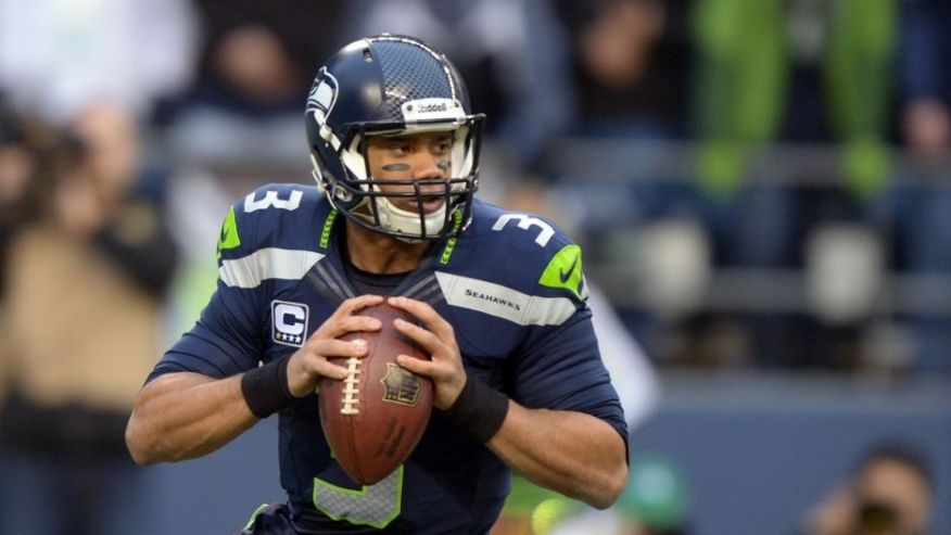 Jan 19 2014 Seattle WA USA Seattle Seahawks quarterback Russell Wilson drops back to pass against the San Francisco 49ers during the first half of the 2013 NFC Championship football game at Century Link Field. Mandatory Credit Kirby Lee-USA TODAY