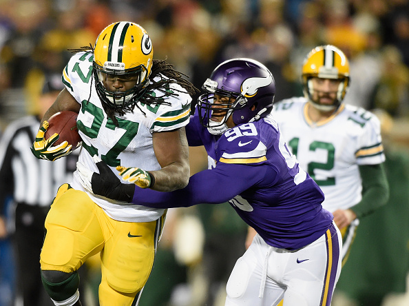 Aaron Rodgers #12 of the Green Bay Packers Eddie Lacy #27