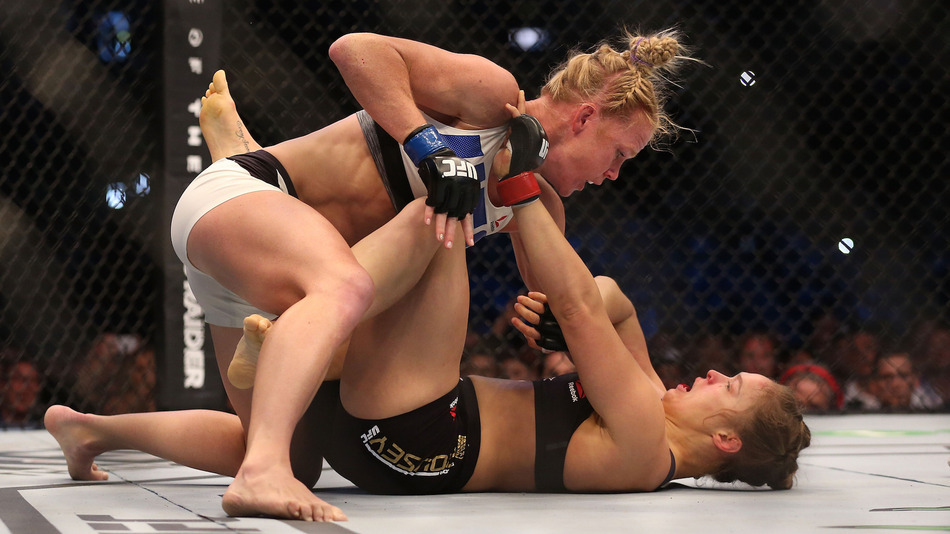 Ronda Rousey is taken down by Holly Holm in their UFC women's bantamweight championship bout