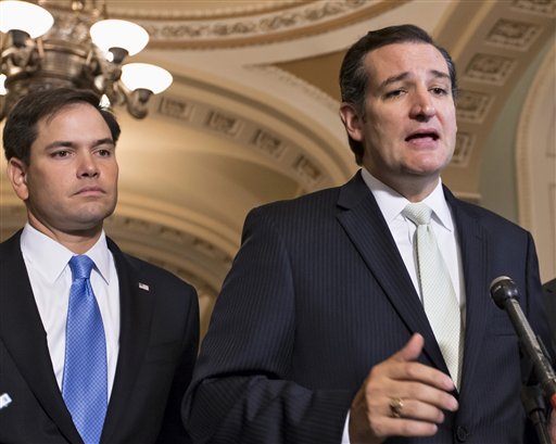 Sen. Ted Cruz R-Texas right accompanied by Sen. Marco Rubio R-Fla. speaks on Capitol Hill in Washington. Republican presidential rivals Rubio and Cruz are backpedaling furiously as they try to outmaneuver each other